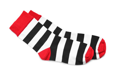 Pair of striped socks on white background, top view
