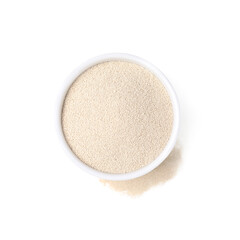 Granulated yeast in bowl on white background, top view