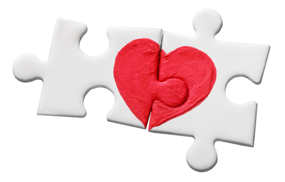 Puzzle pieces with painted red heart isolated on white background