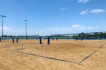 Several sand beach with beach volleyball courts near the lake, zone for active rest on the bank of the river. Concept of summer sport, activity on open air.