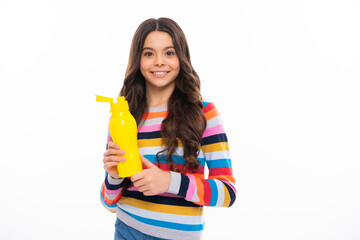 Child teen with water bottle isolated studio background. Water bottle and healthy life. Health and water balance. Happy girl face, positive and smiling emotions.