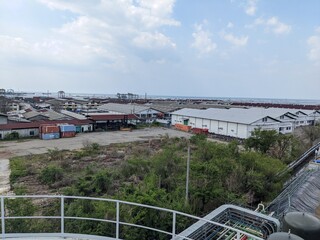 Landscape photo of power plant building with blue, orange and red sky. The photo is perfect for construction photo background, poster industry and pamphlet.