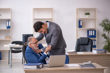 Two male colleagues working in the office
