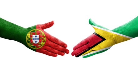 Handshake between Guyana and Portugal flags painted on hands, isolated transparent image.