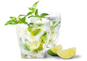 Cold mojito drink, glass of alcohol isolated over white background, fresh mint and lime fruit...