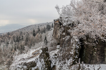 Fototapeta na wymiar Winter view of a rocky landscape at Decinsky Sneznik mountain in the Czech Republic
