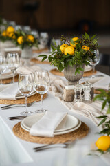 Festive table at the wedding party decorated with lemon arrangements - 539056834