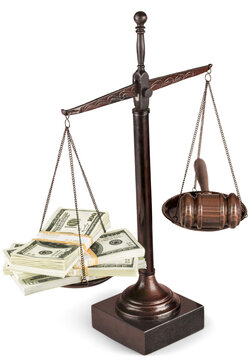 Justice Scales with money and wooden gavel with money on table. Justice concept