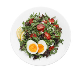 Delicious salad with boiled egg, arugula and tomatoes isolated on white, top view