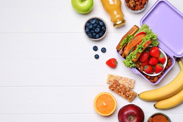 Lunch box with healthy food on white wooden table, flat lay. Space for text