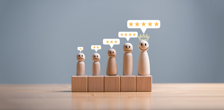 Wooden doll with face emotion and speech bubble with stars for customer evaluation and satisfaction for product and service, Product and service quality assessment, review and feedback..
