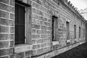 Fototapeta na wymiar Old Stone Block Building Side View in Black and White.