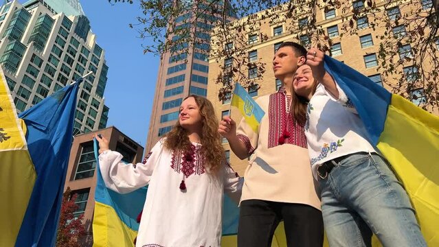 War of Ukraine and Russia crying children Three teenagers left Ukraine for Canada They are waiting for them to return home to their parents Freedom of Ukraine and terrorism in Russia Ukrainian flags