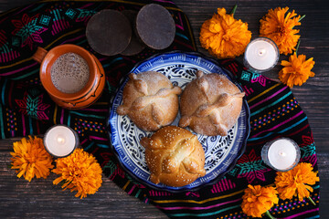 Hojaldra pan de muerto, Mexican bread on Altar with sugar skull and hot chocolate traditional food for Celebration of Mexico's Day of the Dead	
