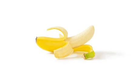 Foto auf Leinwand A peeled banana on white background.  白背景上の剥かれたバナナ © Kana Design Image