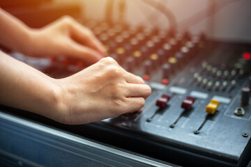 close up hands tuning of sound mixer