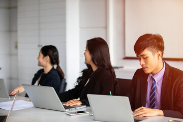 Fototapeta premium Asian businessmen working and sharing ideas meeting in company conference room