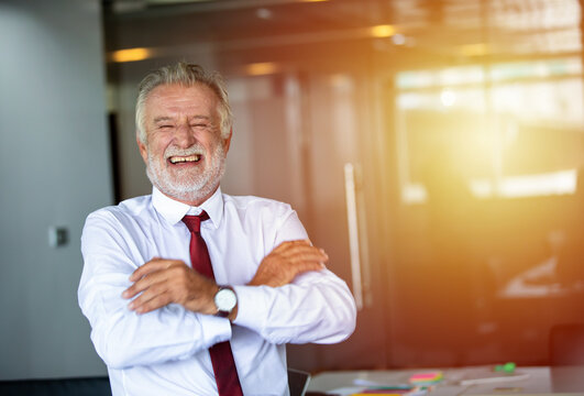 Elderly Business Man Standing Confidently Smiling And Laughing Happy In The Meeting Room