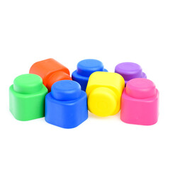 Multi-colored plastic children's construction kit, isolated on a white background. Design and modeling. Development of children's motor skills and thinking. Building different models