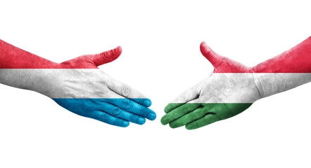 Handshake between Hungary and Luxembourg flags painted on hands, isolated transparent image.