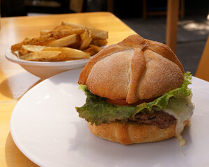 delicious hamburger with bread in the shape of mexican bread of the dead to celebrate the day of the dead