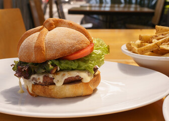 delicious hamburger with bread in the shape of mexican bread of the dead to celebrate the day of the dead