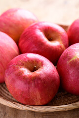 Red apple fruit in basket on wooden background, Healthy fruit