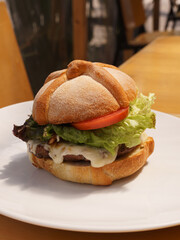 delicious hamburger with bread in the shape of mexican bread of the dead to celebrate the day of the dead