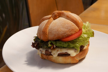 delicious hamburger with bread in the shape of mexican bread of the dead to celebrate the day of the dead