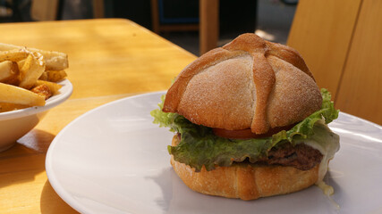 delicious hamburger with bread in the shape of mexican bread of the dead to celebrate the day of the dead