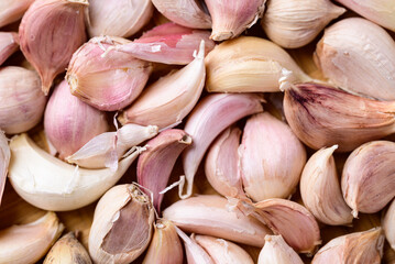 Close up of gloves garlic texture background, organic food ingredient