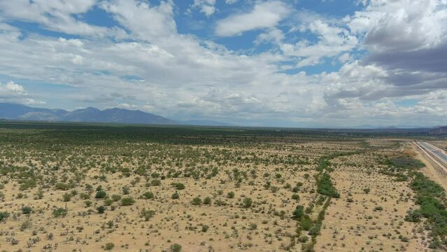 Drone shot of the Sonoran desert in Arizona, slow moving aerial shot with a highway on the edge