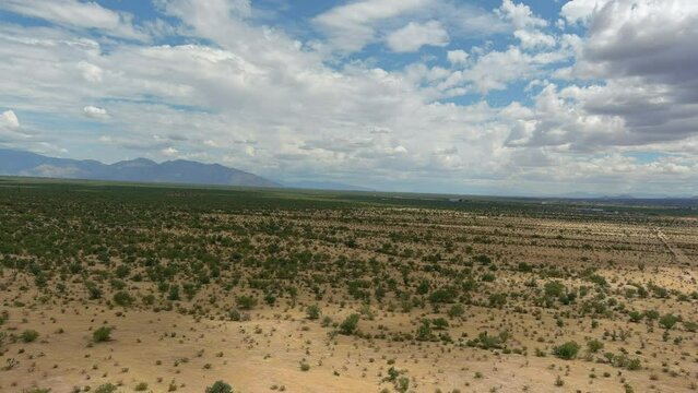 Wide drone shot of the Sonoran desert in Arizona, slow moving aerial shot