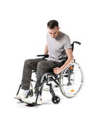 Fototapeta na wymiar Young man in wheelchair isolated on white