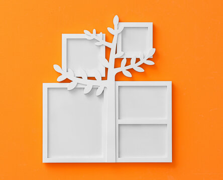 Family tree with photo frames hanging on orange wall
