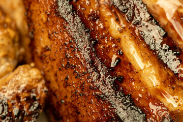Marinated pork ribs grilled. Close-up, selective focus.