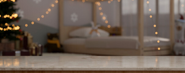 Empty space on marble tabletop over blurred cozy bedroom with Christmas tree