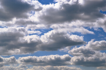 Beautiful white cumulus clouds in the blue sky