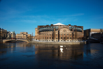 Fototapeta na wymiar Swedish Parliament House a sunny snowy winter evening in Stockholm