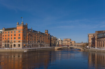 Fototapeta na wymiar Swedish Parliament House the Prime Minister's Office a sunny snowy winter evening in Stockholm