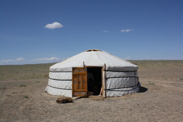 The lonely tent (ger) in the largely desolate Gobi Desert, Umnugovi province, Mongolia. In summer time, the surrounding desert is hot in the afternoon. And it is cold in the night. 