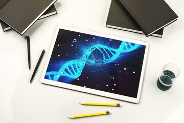 Creative concept with DNA symbol illustration on modern digital tablet screen. Genome research concept. Top view. 3D Rendering