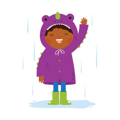 Little Boy In A Dinosaur Raincoat Rainy day
