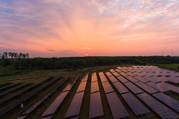 Beautiful sunset over Solar Farm with sunset on the background