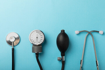 Gray tonometer on a blue background. Medical equipment blood pressure monitor. Healthcare. Place...