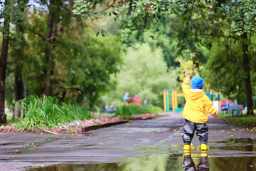 yellow raincoat boy look, autumn seasonal walk in the park