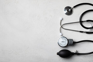 Gray tonometer on a white background. Medical equipment blood pressure monitor. Healthcare. Place for text. Medicine concept. The concept of cardiology.