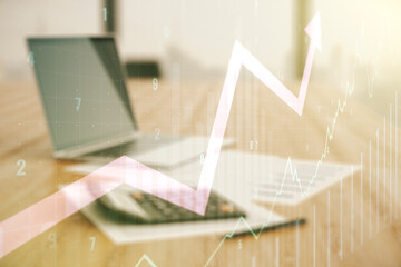 Multi exposure of virtual abstract financial chart and upward arrow interface on blurry calculator...