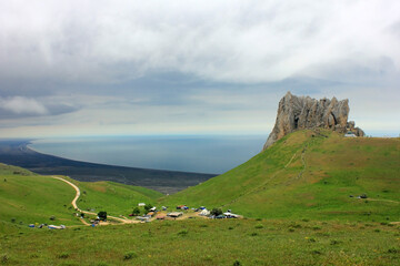 Pilgrims climb Mount Beshbarmag.