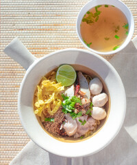 Noodles, Tom Yum, Thai food in a white bowl